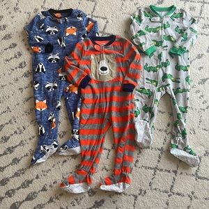 3 long sleeves, footed, fleece, zippered onesie sleepers.  SimpleJoys by Carters